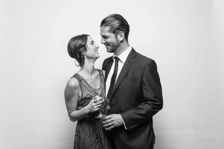 Black and white photo booth portrait of a bride and groom