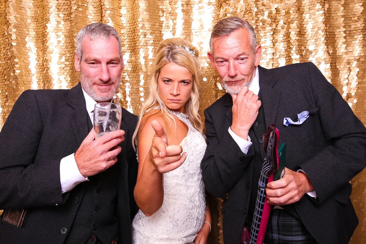 Wedding guests enjoying the vintage open air photo booth
