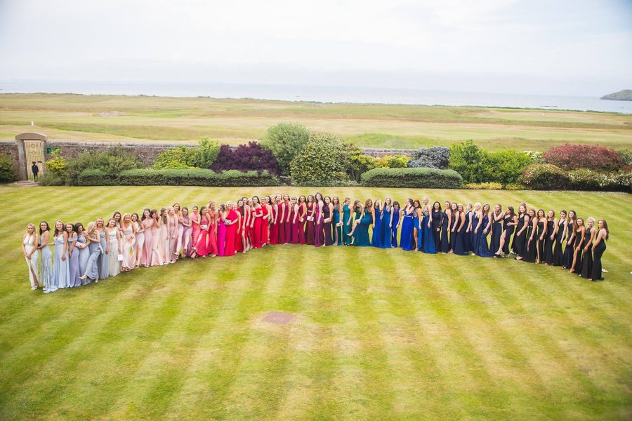 Aerial event photographer shot of a large group of guests on a lawn in Scotland